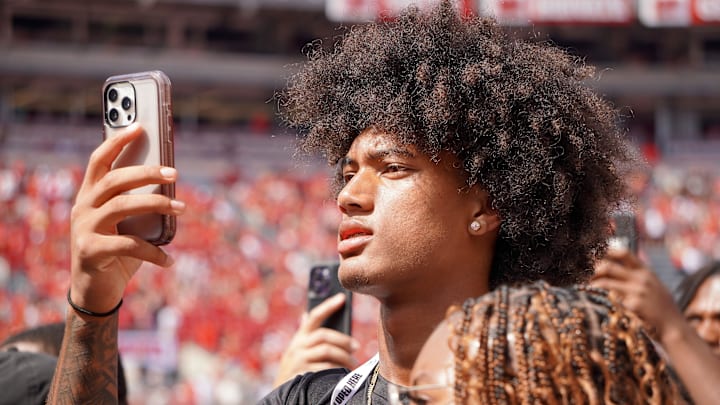 Aug 31, 2024; Columbus, OH, USA; Mater Dei wide receiver Chris Henry Jr. films as Ohio State football warms up before the Buckeyes' 52-6 win over Akron.