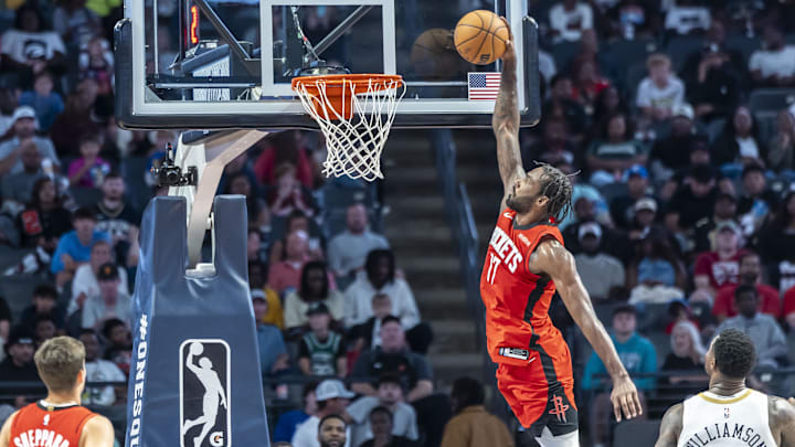 Oct 14, 2025; Birmingham, Alabama, USA; Houston Rockets forward Tari Eason (17) dunks on the New Orleans Pelicans during an NBA preseason game at Legacy Arena at BJCC. Mandatory Credit: Vasha Hunt-Imagn Images