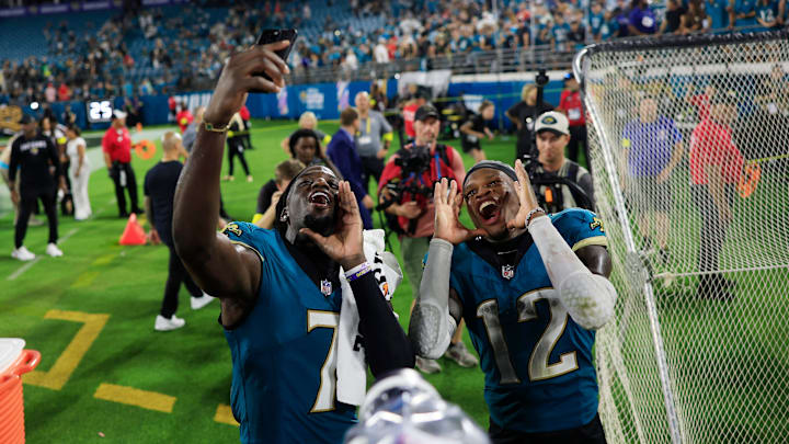 Jacksonville Jaguars wide receiver Brian Thomas Jr. (7) and wide receiver Travis Hunter (12) record a social media video chanting “Duuuval!” after the game of an NFL football matchup at EverBank Stadium, Monday, Oct. 6, 2025, in Jacksonville, Fla. The Jacksonville Jaguars edged the Kansas City Chiefs 31-28. [Corey Perrine/Florida Times-Union]