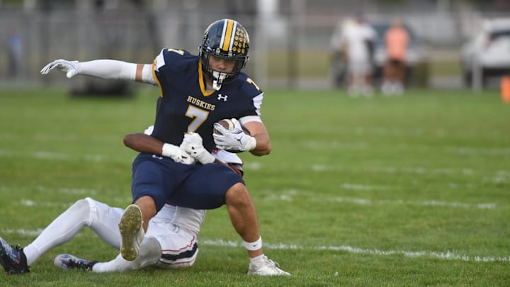 Port Huron Northern's Lincoln Watkins tries to break a tackle during a game against Warren Cousino at Memorial Stadium in Port Huron on Friday, Sept. 20, 2024.