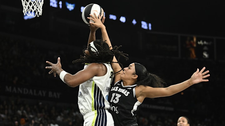 Jun 13, 2025; Las Vegas, Nevada, USA; Las Vegas Aces guard Aaliyah Nye (13) fouls Dallas Wings forward Myisha Hines-Allen (2) in the third quarter of their game at Michelob Ultra Arena. Mandatory Credit: Candice Ward-Imagn Images