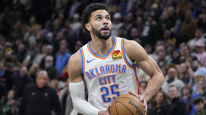 Jan 21, 2026; Milwaukee, Wisconsin, USA; Oklahoma City Thunder guard Ajay Mitchell (25) goest up for shot after stealing the ball from he Milwaukee Bucks at Fiserv Forum. Mandatory Credit: Michael McLoone-Imagn Images