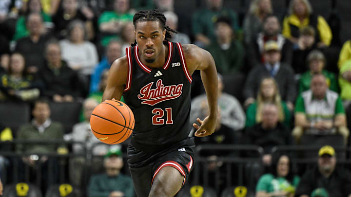 Indiana Hoosiers forward Mackenzie Mgbako dribbles the ball against the Oregon Ducks. Indiana Hoosiers forward Mackenzie Mgbako dribbles the ball against the Oregon Ducks.