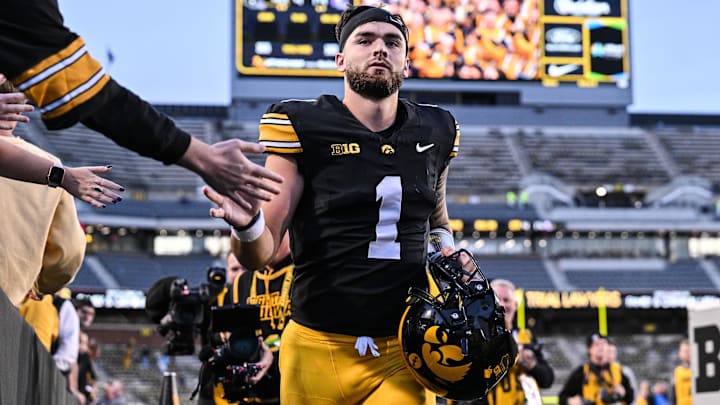 Oct 26, 2024; Iowa City, Iowa, USA; Iowa Hawkeyes quarterback Brendan Sullivan (1) runs off the field and greets fans after a game against the Northwestern Wildcats at Kinnick Stadium. Mandatory Credit: Jeffrey Becker-Imagn Images