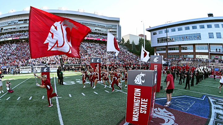 Sep 20, 2025; Pullman, Washington, USA; Washington State Cougars run onto the field before a game against the Washington Huskies at Gesa Field at Martin Stadium. Mandatory Credit: James Snook-Imagn Images