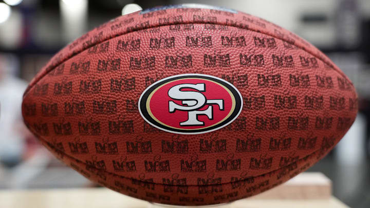 A football with a San Francisco 49ers logo 
