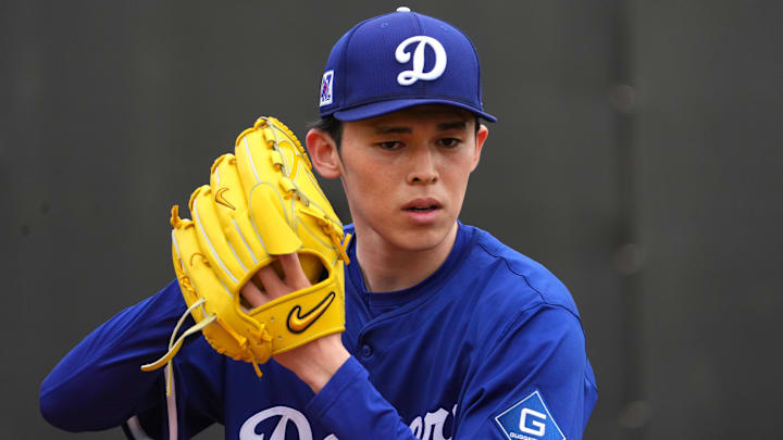 Los Angeles Dodgers pitcher Roki Sasaki (11) throws during a Spring Training workout at Camelback Ranch in Glendale, Arizona, on Feb. 12, 2025.