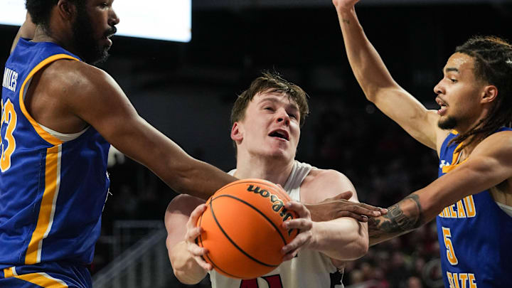 Bearcats Simas Lukosius (41) goes up against Moreheads defense during their game against the Morehead State Eagles at Fifth Third Arena on Friday November 8, 2024. Bearcats lead the game at halftime with a score of 37-19. Bearcats Simas Lukosius (41) goes up against Moreheads defense during their game against the Morehead State Eagles at Fifth Third Arena on Friday November 8, 2024. Bearcats lead the game at halftime with a score of 37-19.