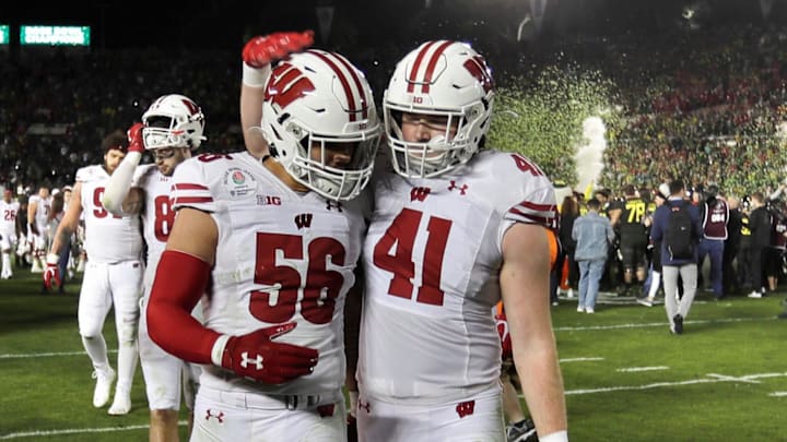 Wisconsin linebackers Zack Baun (56) and Noah Burks (41) walk off the field after Oregon's 28-27 win in the 2020 Rose Bowl game Jan. 1, 2020  in Pasadena, Calif.
