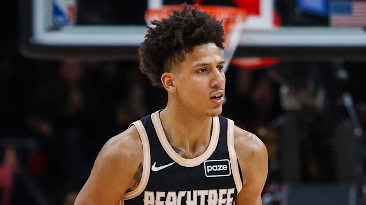 Jan 19, 2026; Atlanta, Georgia, USA; Atlanta Hawks forward Jalen Johnson (1) celebrates a three point shot against the Milwaukee Bucks during the fourth quarter at State Farm Arena. Mandatory Credit: Jordan Godfree-Imagn Images