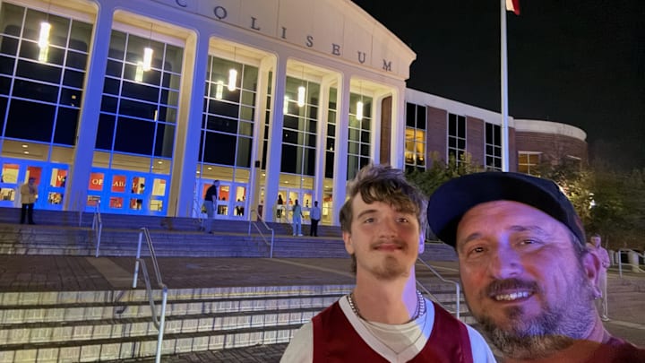 Morgan Crabtree outside Coleman Coliseum with his son, Jacob, for the season opener against UNC Asheville on Nov. 4, 2024