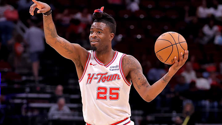 Mar 23, 2024; Houston, Texas, USA; Houston Rockets forward Reggie Bullock Jr. (25) handles the ball against the Utah Jazz during the fourth quarter at Toyota Center. Mandatory Credit: Erik Williams-Imagn Images