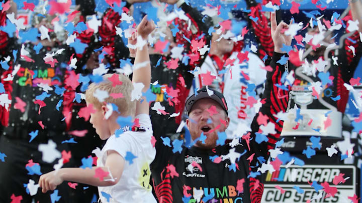 Mar 1, 2026; Austin, Texas, USA;  NASCAR Cup Series driver Tyler Reddick (45) is showered with graffiti after winning the NASCAR Cup Series Duramax Texas Grand Prix Powered by RelaDyne at Circuit of the Americas.