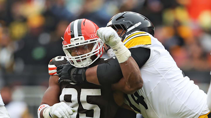 Cleveland Browns defensive end Myles Garrett (95) tries to get past Pittsburgh Steelers guard Spencer Anderson (74) as quarterback Aaron Rodgers (8) looks to throw during the second half of an NFL football game at Huntington Bank Field, Dec. 28, 2025, in Cleveland, Ohio.