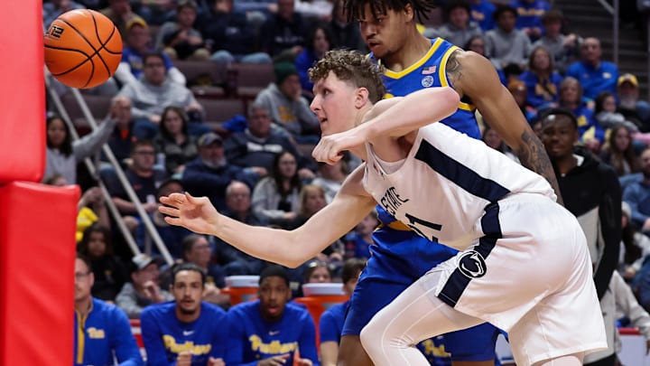 Dec 21, 2025; Hershey, Pennsylvania, USA; Penn State Nittany Lions forward Justin Houser (21) chases the loose ball during the second half against the Pittsburg Panthers at Giant Center. Mandatory Credit: Matthew O'Haren-Imagn Images