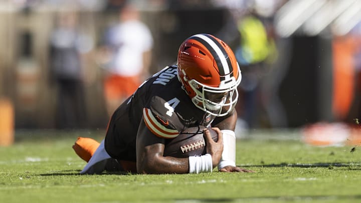 Oct 20, 2024; Cleveland, Ohio, USA; Cleveland Browns quarterback Deshaun Watson (4) falls to the ground with a torn Achilles during the second quarter against the Cincinnati Bengals at Huntington Bank Field. Mandatory Credit: Scott Galvin-Imagn Images Oct 20, 2024; Cleveland, Ohio, USA; Cleveland Browns quarterback Deshaun Watson (4) falls to the ground with a torn Achilles during the second quarter against the Cincinnati Bengals at Huntington Bank Field. Mandatory Credit: Scott Galvin-Imagn Images