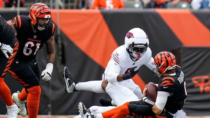 Cincinnati Bengals quarterback Joe Burrow (9) is sacked in the second quarter of the NFL Week 17 game between the Cincinnati Bengals and the Arizona Cardinals at Paycor Stadium in Downtown Cincinnati on Sunday, Dec. 28, 2025. The Bengals led 23-7 at halftime.