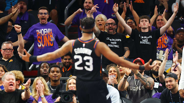 Apr 17, 2026; Phoenix, Arizona, USA; Phoenix Suns fans in the crowd cheer the shot of guard Jordan Goodwin (23) against the Golden State Warriors during the play-in rounds of the 2026 NBA Playoffs at Mortgage Matchup Center. Mandatory Credit: Mark J. Rebilas-Imagn Images