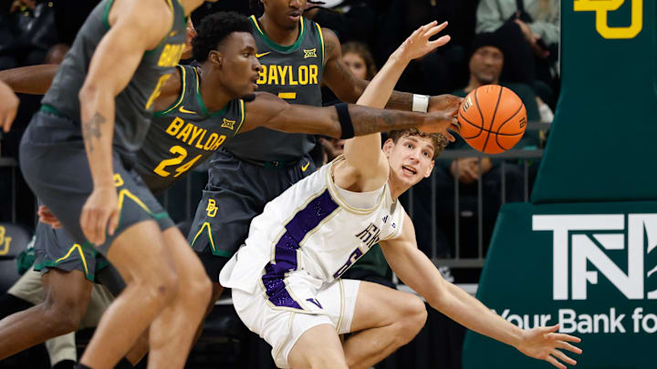 Baylor guard Tounde Yessoufou (24) deflects a pass intended for Hannes Steinbach on Sunday night.