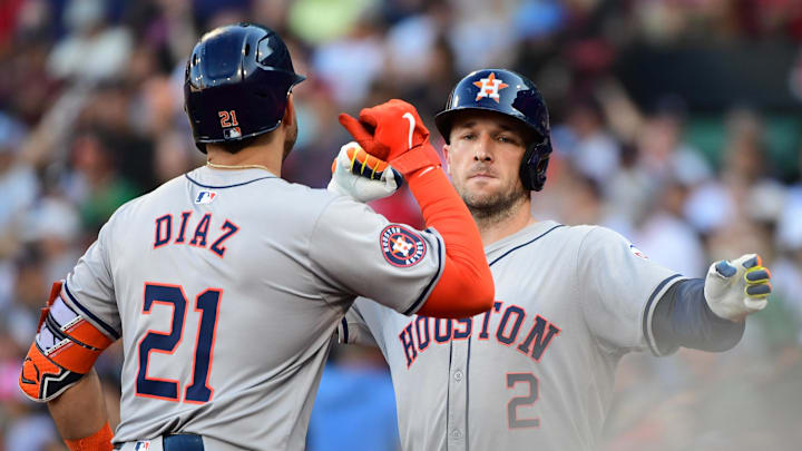 Aug 10, 2024; Boston, Massachusetts, USA;  Houston Astros designated hitter Yainer Diaz (21) reacts with third baseman Alex Bregman (2) after Bregman hit a home run during the seventh inning against the Boston Red Sox at Fenway Park. Mandatory Credit: Bob DeChiara-Imagn Images