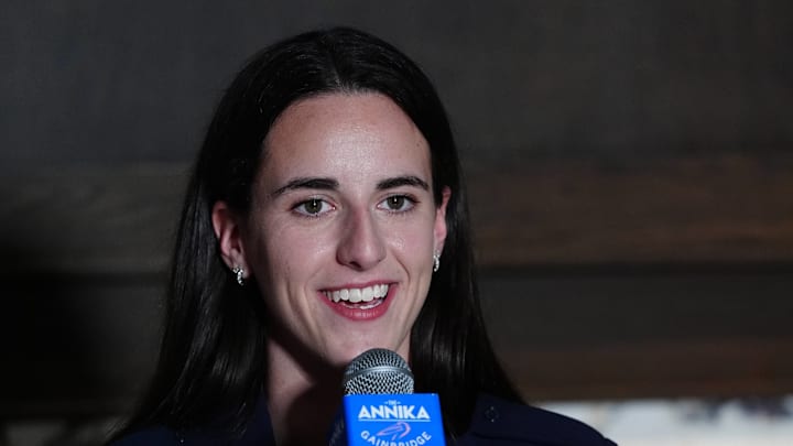 Indiana Fever guard Caitlin Clark speaks at a press conference