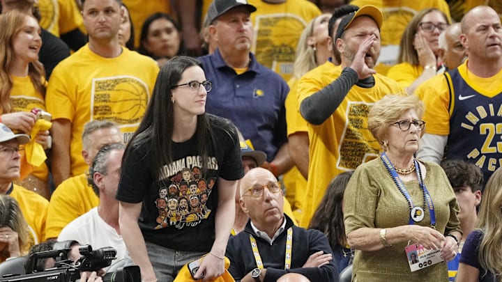 Caitlin Clark looks on during the first half during game four of the 2025 NBA Finals between the Oklahoma City Thunder and the Indiana Pacers at Gainbridge Fieldhouse.
