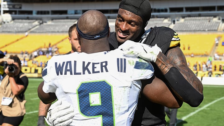 Sep 14, 2025; Pittsburgh, Pennsylvania, USA; Pittsburgh Steelers wide receiver DK Metcalf (4) greets Seattle Seahawks running back Kenneth Walker III (9) ollowing their game at Acrisure Stadium. 