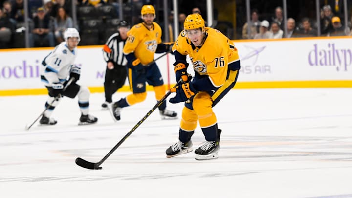 Nov 9, 2024; Nashville, Tennessee, USA;  Nashville Predators defenseman Brady Skjei (76) skates with the puck against against the Utah Hockey Club during the third period at Bridgestone Arena. Mandatory Credit: Steve Roberts-Imagn Images