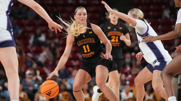 ASU Sun Devils guard Marley Washenitz (11) brings the ball up court as Kansas State Wildcats guard Taryn Sides (11) defends at Desert Financial Arena in Tempe on Feb. 1, 2026.