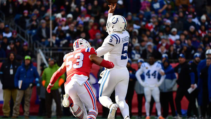 Dec 1, 2024; Foxborough, Massachusetts, USA;  Indianapolis Colts quarterback Anthony Richardson (5) throws a touchdown pass while New England Patriots linebacker Christian Elliss (53) defends during the first half at Gillette Stadium. Mandatory Credit: Bob DeChiara-Imagn Images