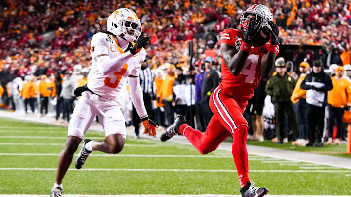 Ohio State wide receiver Jeremiah Smith catches a touchdown pass against Tennessee defensive back Jermod McCoy.