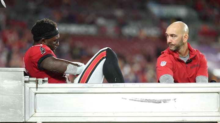 Oct 21, 2024; Tampa, Florida, USA; Tampa Bay Buccaneers wide receiver Chris Godwin (14) is carted off the field against the Baltimore Ravens in the fourth quarter at Raymond James Stadium. Mandatory Credit: Nathan Ray Seebeck-Imagn Images