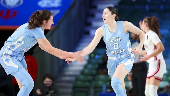 Nov 25, 2024; Paradise Island, Bahamas, BHS; North Carolina Tar Heels guard Lanie Grant (0) celebrates with North Carolina Tar Heels forward Ciera Toomey (21) after scoring during the first half against the Indiana Hoosiers at the Atlantis Resort. Mandatory Credit: Kevin Jairaj-Imagn Images Nov 25, 2024; Paradise Island, Bahamas, BHS; North Carolina Tar Heels guard Lanie Grant (0) celebrates with North Carolina Tar Heels forward Ciera Toomey (21) after scoring during the first half against the Indiana Hoosiers at the Atlantis Resort. Mandatory Credit: Kevin Jairaj-Imagn Images