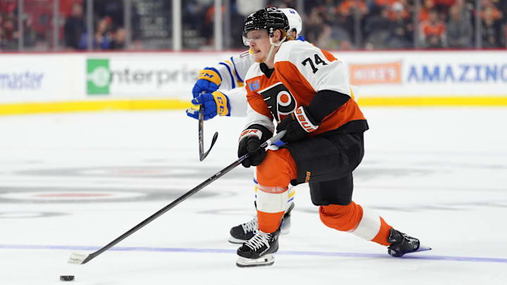 Mar 29, 2025; Philadelphia, Pennsylvania, USA; Philadelphia Flyers right wing Owen Tippett (74) reaches for the puck against the Buffalo Sabres in the second period at Wells Fargo Center. Mandatory Credit: Kyle Ross-Imagn Images
