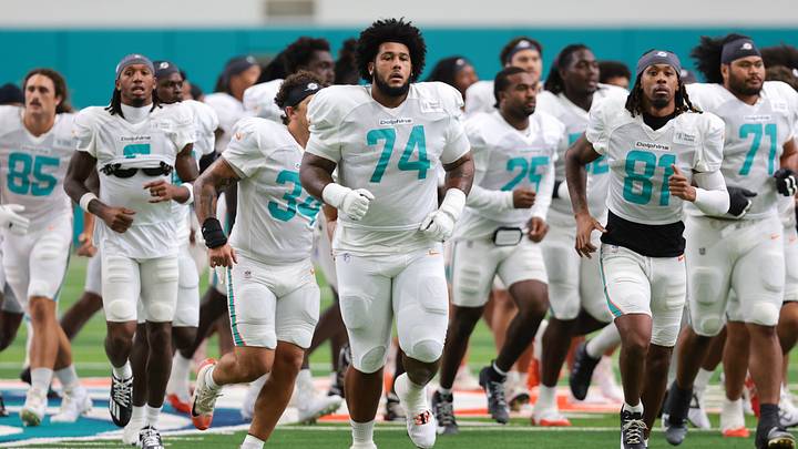 Miami Dolphins offensive lineman Kadyn Proctor (74) runs on the field during joint practice with the New York Giants at Baptist Health Training Complex. Miami Dolphins offensive lineman Kadyn Proctor (74) runs on the field during joint practice with the New York Giants at Baptist Health Training Complex.