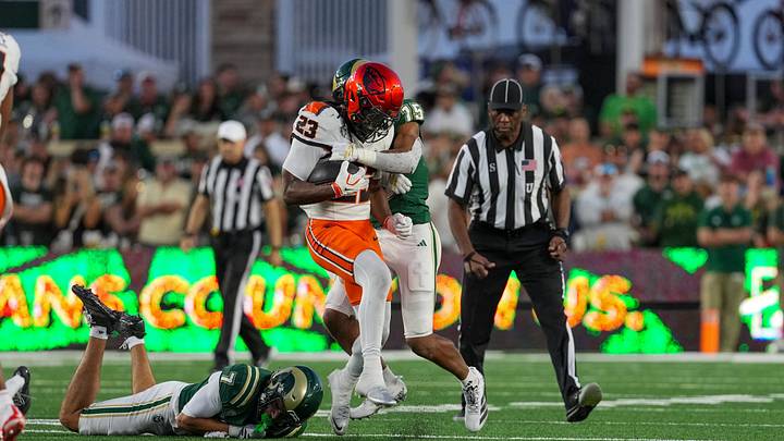 Oct 3, 2026; Fort Collins, Colorado, USA; Oregon State Beavers running back AJ Newberry (23) is tackled by Colorado State Rams safety Tre'Shawn Moore (15) in the second half at Sonny Lubick Field at Canvas Stadium. Mandatory Credit: Andrew Rydland-Imagn Images Oct 3, 2026; Fort Collins, Colorado, USA; Oregon State Beavers running back AJ Newberry (23) is tackled by Colorado State Rams safety Tre'Shawn Moore (15) in the second half at Sonny Lubick Field at Canvas Stadium. Mandatory Credit: Andrew Rydland-Imagn Images