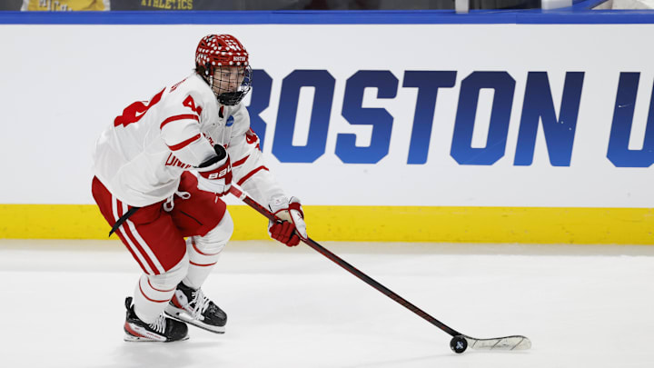 Boston University defenseman Cole Hutson skates with the puck in the first period against the Cornell. Boston University defenseman Cole Hutson skates with the puck in the first period against the Cornell.
