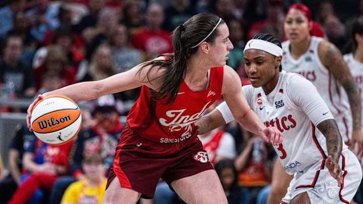 May 15, 2026; Indianapolis, Indiana, USA; Indiana Fever guard Caitlin Clark (22) dribbles the ball while Washington Mystics guard Rori Harmon (3) defends in the first half at Gainbridge Fieldhouse. Mandatory Credit: Trevor Ruszkowski-Imagn Images