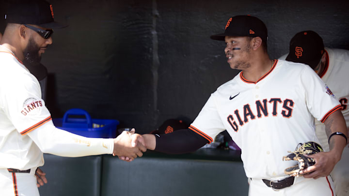 Sep 27, 2025; San Francisco, California, USA; San Francisco Giants right fielder Jerar Encarnacion (left) and first baseman Rafael Devers (16) shakes hands before taking on the Colorado Rockies at Oracle Park. Mandatory Credit: D. Ross Cameron-Imagn Images Sep 27, 2025; San Francisco, California, USA; San Francisco Giants right fielder Jerar Encarnacion (left) and first baseman Rafael Devers (16) shakes hands before taking on the Colorado Rockies at Oracle Park. Mandatory Credit: D. Ross Cameron-Imagn Images