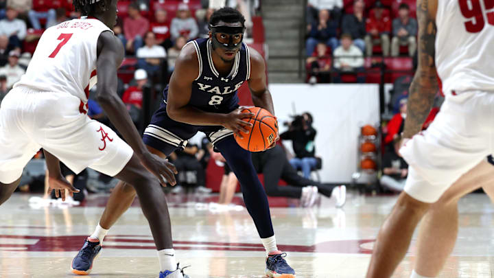Dec 29, 2025; Tuscaloosa, Alabama, USA; Alabama Crimson Tide forward Taylor Bol Bowen (7) guards Yale Bulldogs forward Isaac Celiscar (8) during the second half at Coleman Coliseum.