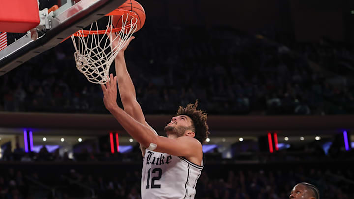Nov 18, 2025; New York, New York, USA; Duke Blue Devils forward Cameron Boozer (12) goes to the basket against the Kansas Jayhawks during the second half at Madison Square Garden. 