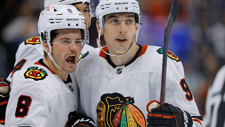 Oct 28, 2024; Denver, Colorado, USA; Chicago Blackhawks center Ryan Donato (8) celebrates his goal with right wing Ilya Mikheyev (95) in the third period against the Colorado Avalanche at Ball Arena. Mandatory Credit: Isaiah J. Downing-Imagn Images