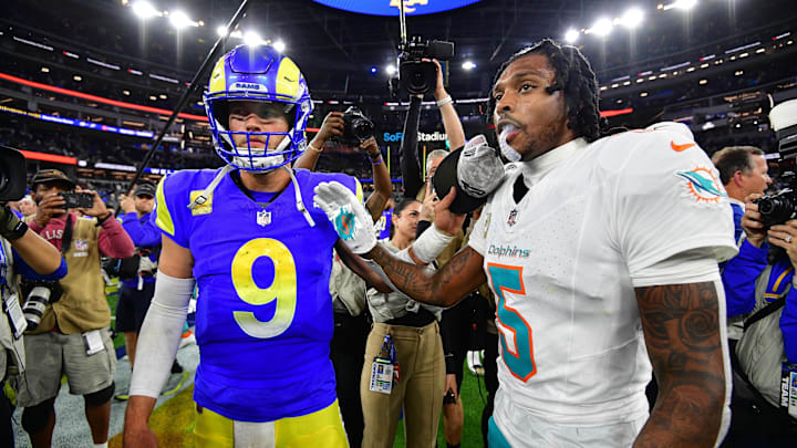 Nov 11, 2024; Inglewood, California, USA; Los Angeles Rams quarterback Matthew Stafford (9) meets with Miami Dolphins cornerback Jalen Ramsey (5) following the game at SoFi Stadium. Mandatory Credit: Gary A. Vasquez-Imagn Images