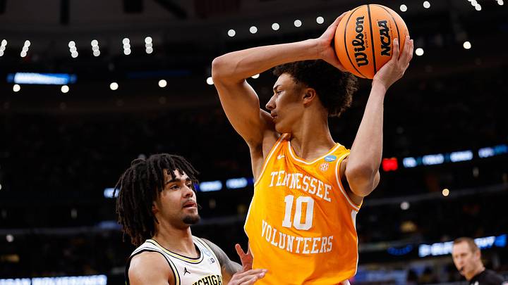 Mar 29, 2026; Chicago, IL, USA; Tennessee Volunteers forward Nate Ament (10) looks to pass while defended by Michigan Wolverines guard Elliot Cadeau (3) in the first half during an Elite Eight game of the Midwest Regional of the men's 2026 NCAA Tournament at United Center. Mandatory Credit: Kamil Krzaczynski-Imagn Images Mar 29, 2026; Chicago, IL, USA; Tennessee Volunteers forward Nate Ament (10) looks to pass while defended by Michigan Wolverines guard Elliot Cadeau (3) in the first half during an Elite Eight game of the Midwest Regional of the men's 2026 NCAA Tournament at United Center. Mandatory Credit: Kamil Krzaczynski-Imagn Images