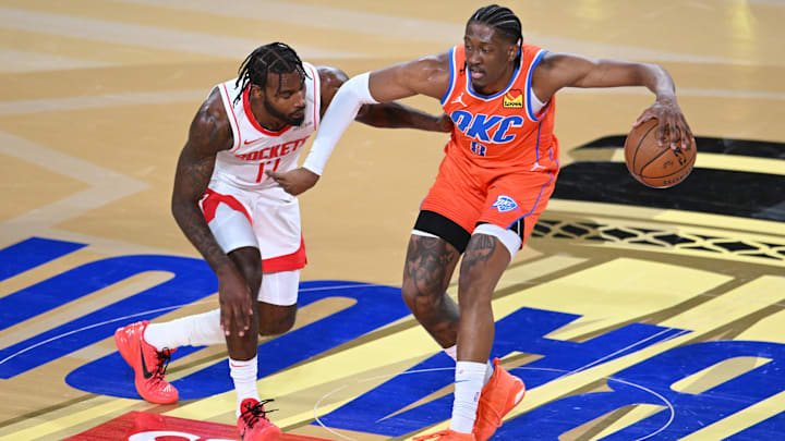 Dec 14, 2024; Las Vegas, Nevada, USA; Oklahoma City Thunder forward Jalen Williams (8) controls the ball against Houston Rockets forward Tari Eason (17) during the first half in a semifinal of the 2024 Emirates NBA Cup at T-Mobile Arena. Mandatory Credit: Candice Ward-Imagn Images
