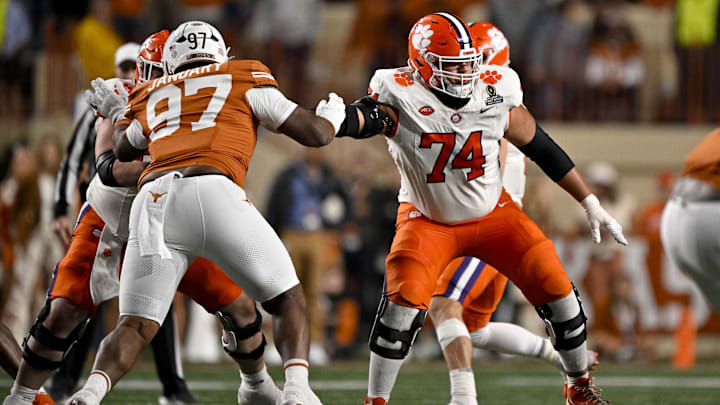 Dec 21, 2024; Austin, Texas, USA; Texas Longhorns defensive lineman Alex January (97) and Clemson Tigers offensive lineman Marcus Tate (74) in action during the game between the Texas Longhorns and the Clemson Tigers in the CFP National Playoff First Round at Darrell K Royal-Texas Memorial Stadium. Mandatory Credit: Jerome Miron-Imagn Images