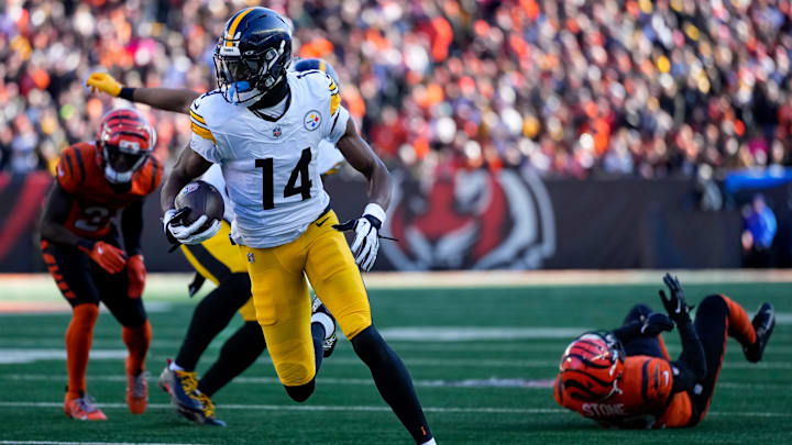Pittsburgh Steelers wide receiver George Pickens (14) breaks through the defense for a touchdown reception in the first quarter of the NFL Week 13 game between the Cincinnati Bengals and the Pittsburgh Steelers at Paycor Stadium in downtown Cincinnati on Sunday, Dec. 1, 2024. Pittsburgh Steelers wide receiver George Pickens (14) breaks through the defense for a touchdown reception in the first quarter of the NFL Week 13 game between the Cincinnati Bengals and the Pittsburgh Steelers at Paycor Stadium in downtown Cincinnati on Sunday, Dec. 1, 2024.
