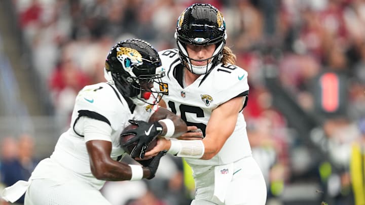 Nov 23, 2025; Glendale, Arizona, USA; Jacksonville Jaguars quarterback Trevor Lawrence (16) hands the ball off to Jacksonville Jaguars running back Travis Etienne Jr. (1) during the first quarter against the Arizona Cardinals at State Farm Stadium. Nov 23, 2025; Glendale, Arizona, USA; Jacksonville Jaguars quarterback Trevor Lawrence (16) hands the ball off to Jacksonville Jaguars running back Travis Etienne Jr. (1) during the first quarter against the Arizona Cardinals at State Farm Stadium.