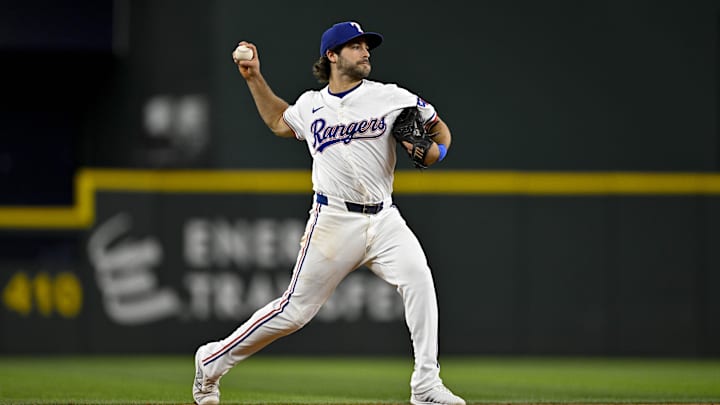 Aug 15, 2024; Arlington, Texas, USA; Texas Rangers shortstop Josh Smith (8) in action during the game between the Texas Rangers and the Minnesota Twins at Globe Life Field.