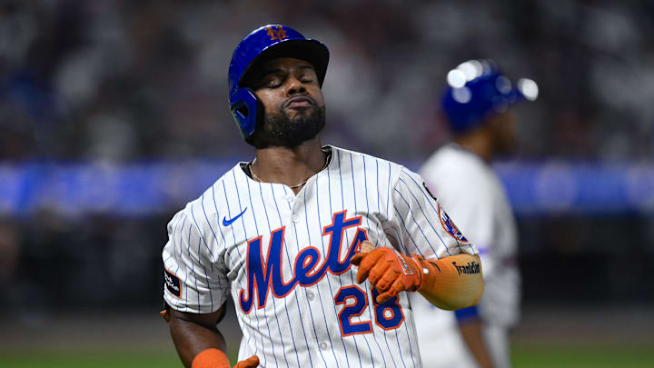 Aug 28, 2025; New York City, New York, USA; New York Mets outfielder Cedric Mullins (28) reacts after hitting a line drive for an out against the Miami Marlins during the sixth inning  at Citi Field. Mandatory Credit: John Jones-Imagn Images